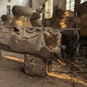 Closeup of stainless steel bench shaped as a wooden log.