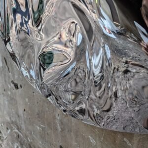 Closeup of Wall Sculpture Made of Stainless Steel with a Sculptural Texture Reminiscent of Water