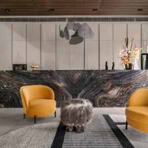Sculptural pouf with fur in a sitting area.