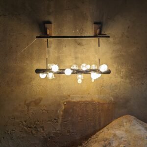 Suspended sculptural light with a stainless steel body and blown glass balls.