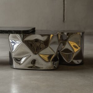 Detail of sculptural stainless steel base of Colgada Coffee Table