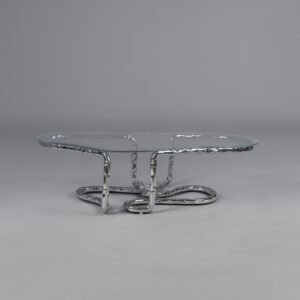 Lasso Coffee Table with looping polished stainless steel base and glass top, studio shot