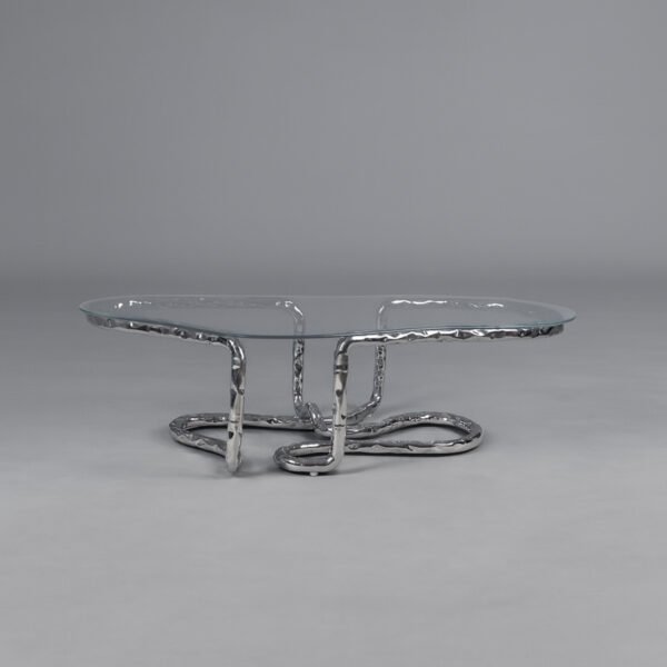 Lasso Coffee Table with looping polished stainless steel base and glass top, studio shot
