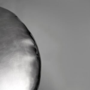 Close-up of Pebble Coffee Table antique steel top with softened pebble-like contours